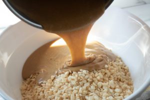 Scotcheroos - Add peanut butter mix to rice