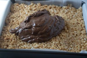 Scotcheroos - Add chocolate mix to rice mix